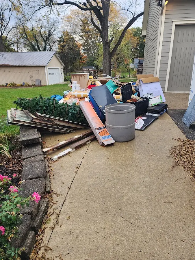 Dumpster being loaded with debris for 3 Yard Dumpster Rental in Yorkville